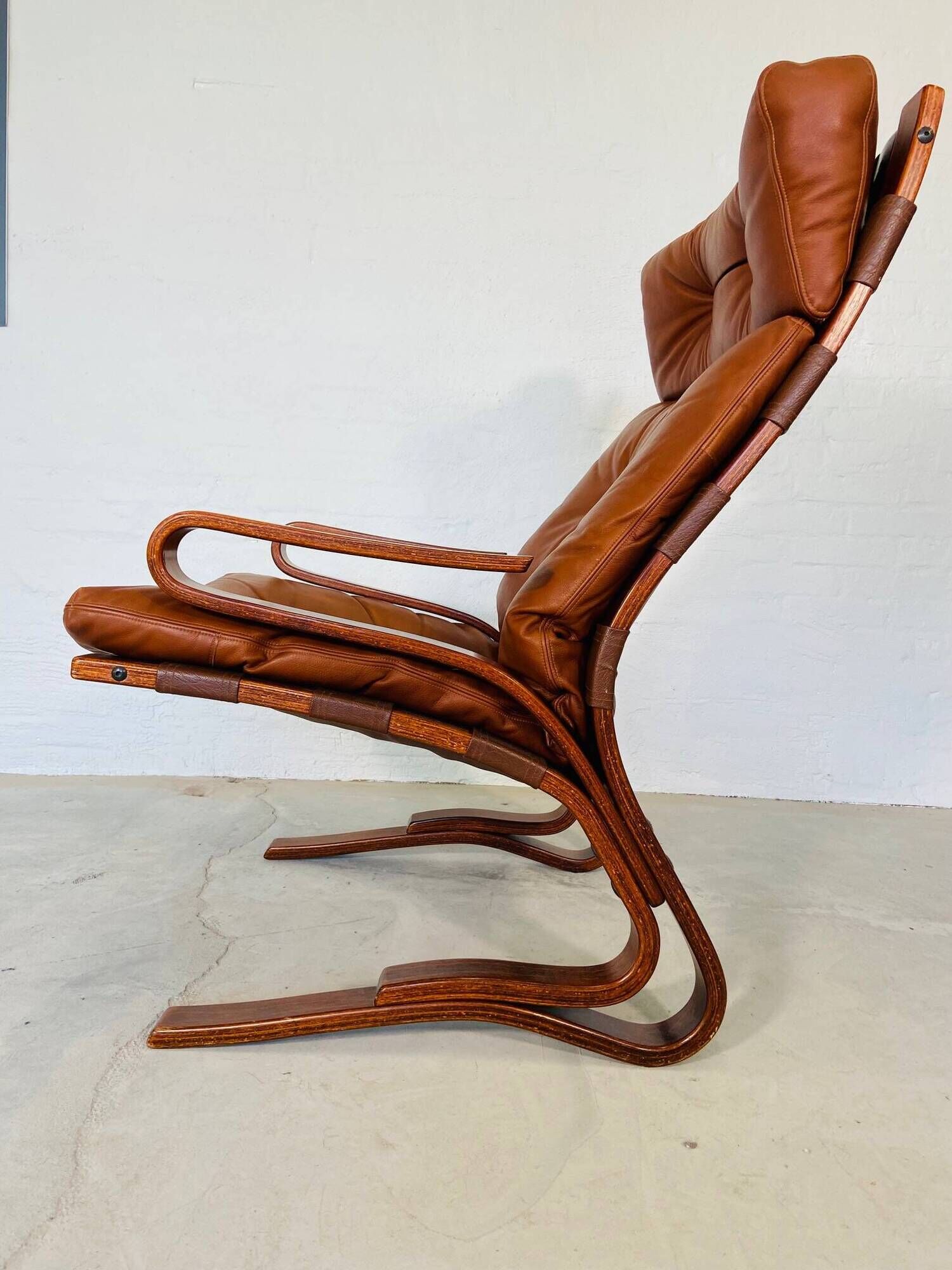 Vintage scandinavian cognac lounge chair by oddvin rykken 1960s