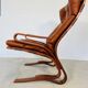 Vintage scandinavian cognac lounge chair by oddvin rykken 1960s