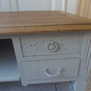 Coffee table on casters, made from an old desk, pearl gray base and belt.