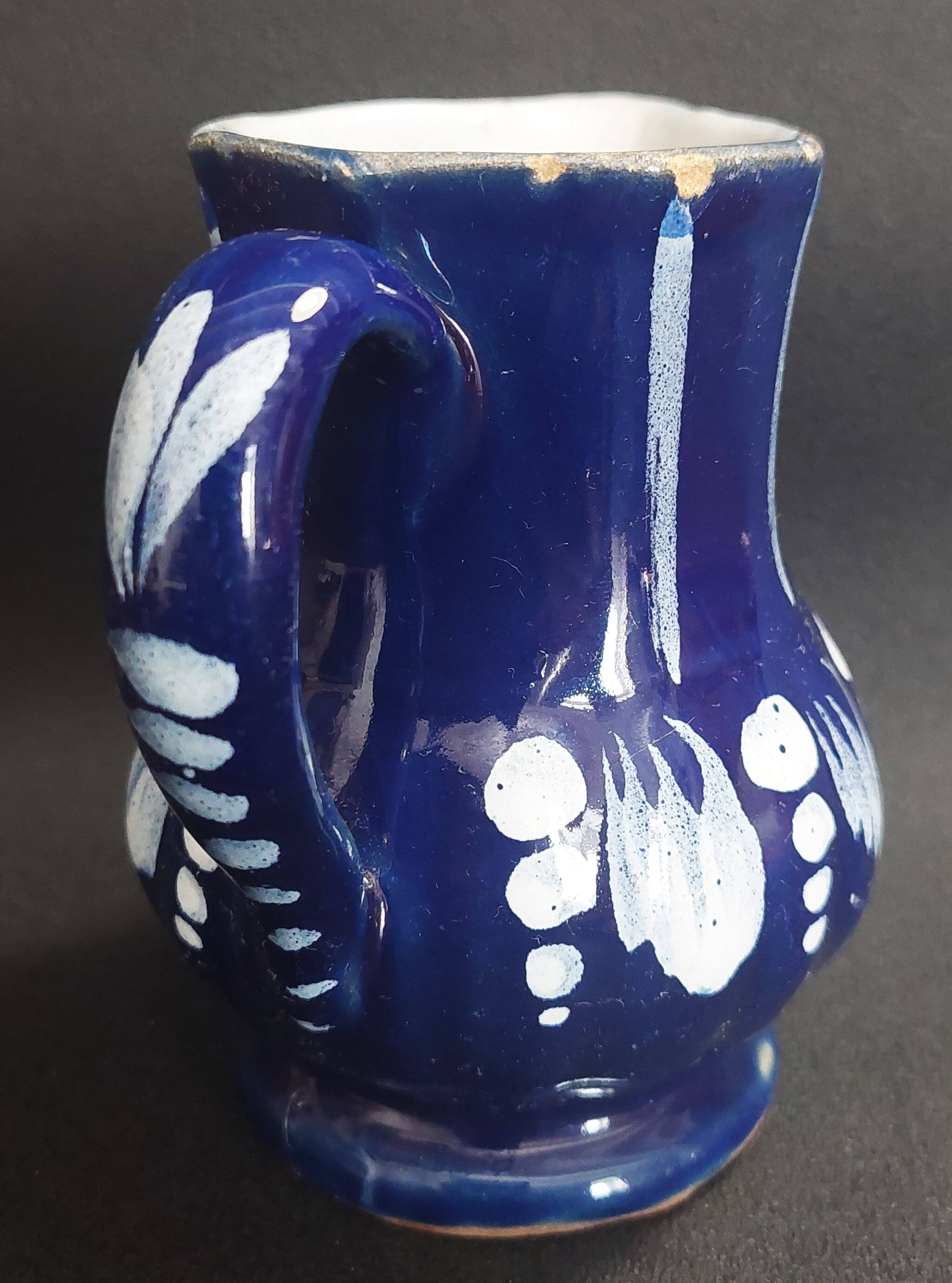 Earthenware pitcher from the North of France with blue covering, 19th century