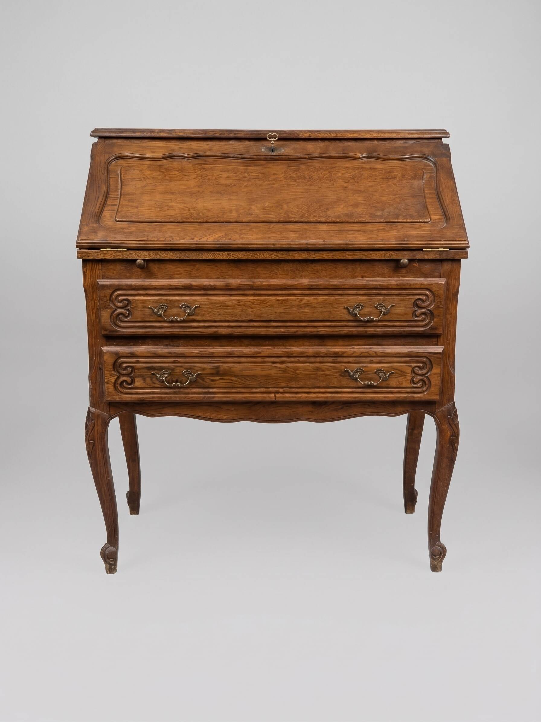 Charming antique oak secretary with drawers.