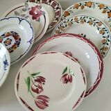 Set of 8 ironstone plates with coordinated designs.