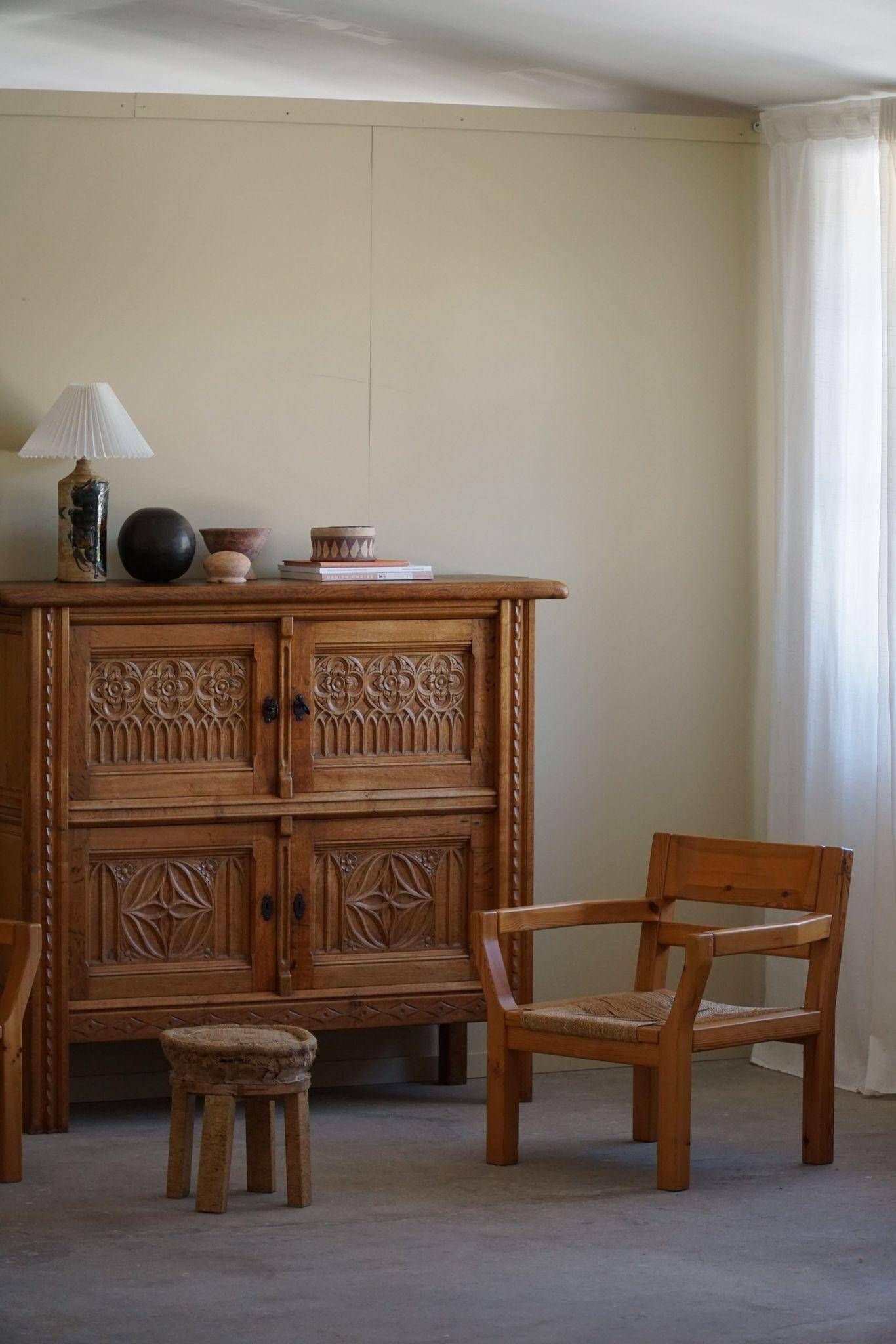Tage Poulsen, a pair of brutalist chairs in pine and cord, Danish modern style, 1970s.