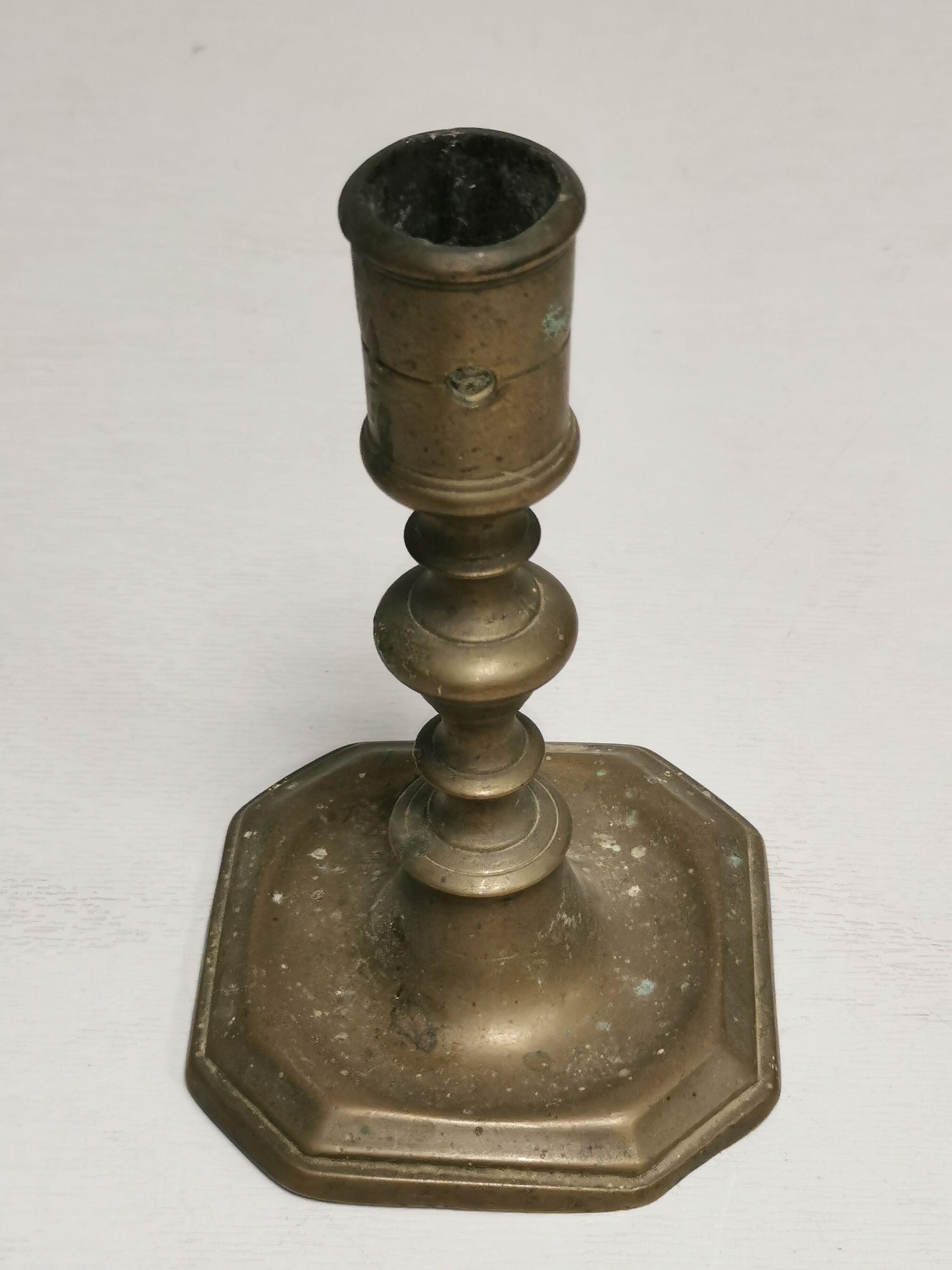 Old bronze candle holder, seventeenth century