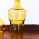 Set of two vintage amber glass carafes attributed to Lubiana.