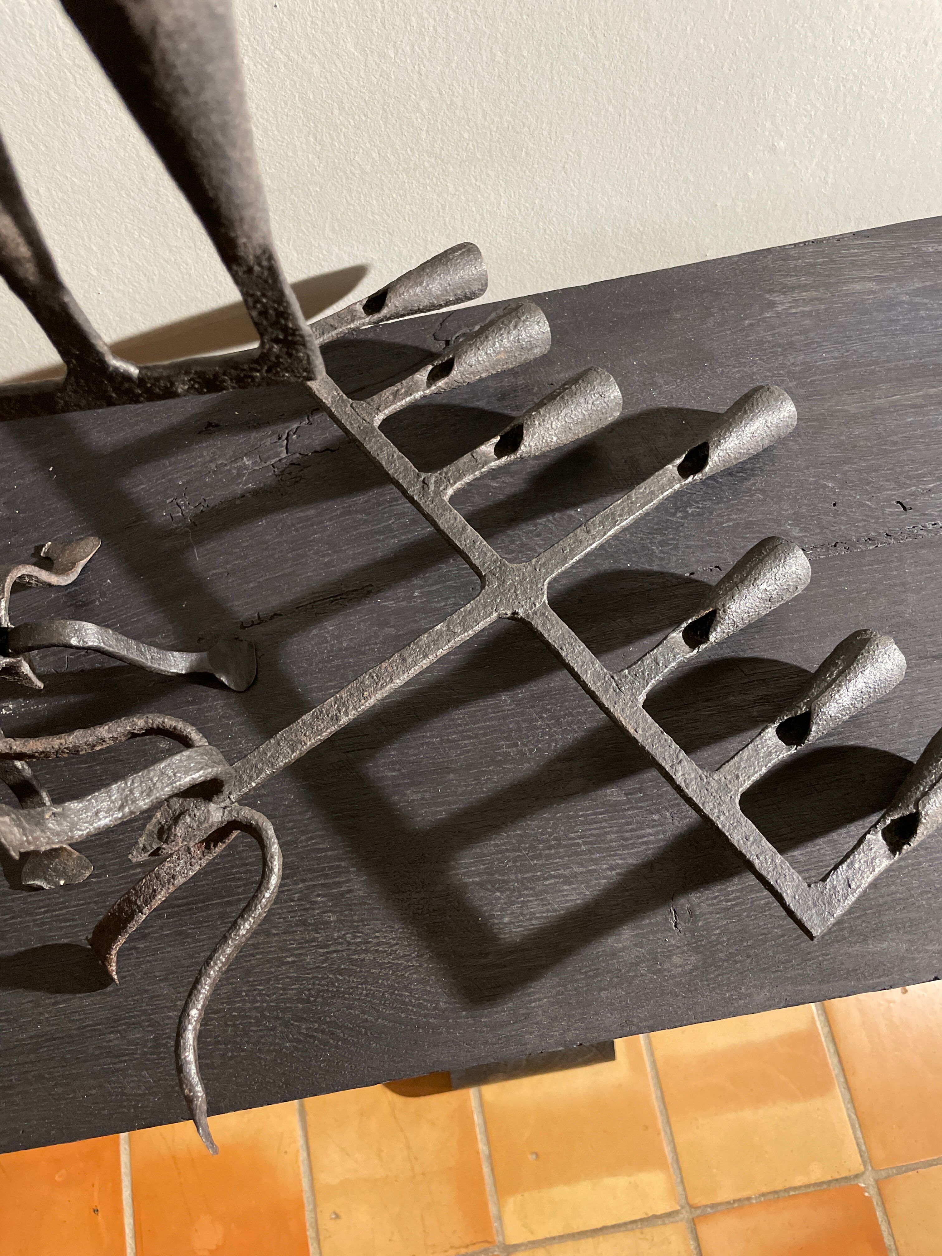 Pair of beaten iron candlesticks