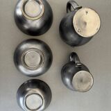 Two pitchers and three Elchinger ceramic bowls black and yellow background 1960