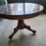 Round pedestal table with marble top and mahogany tripod from the 19th century