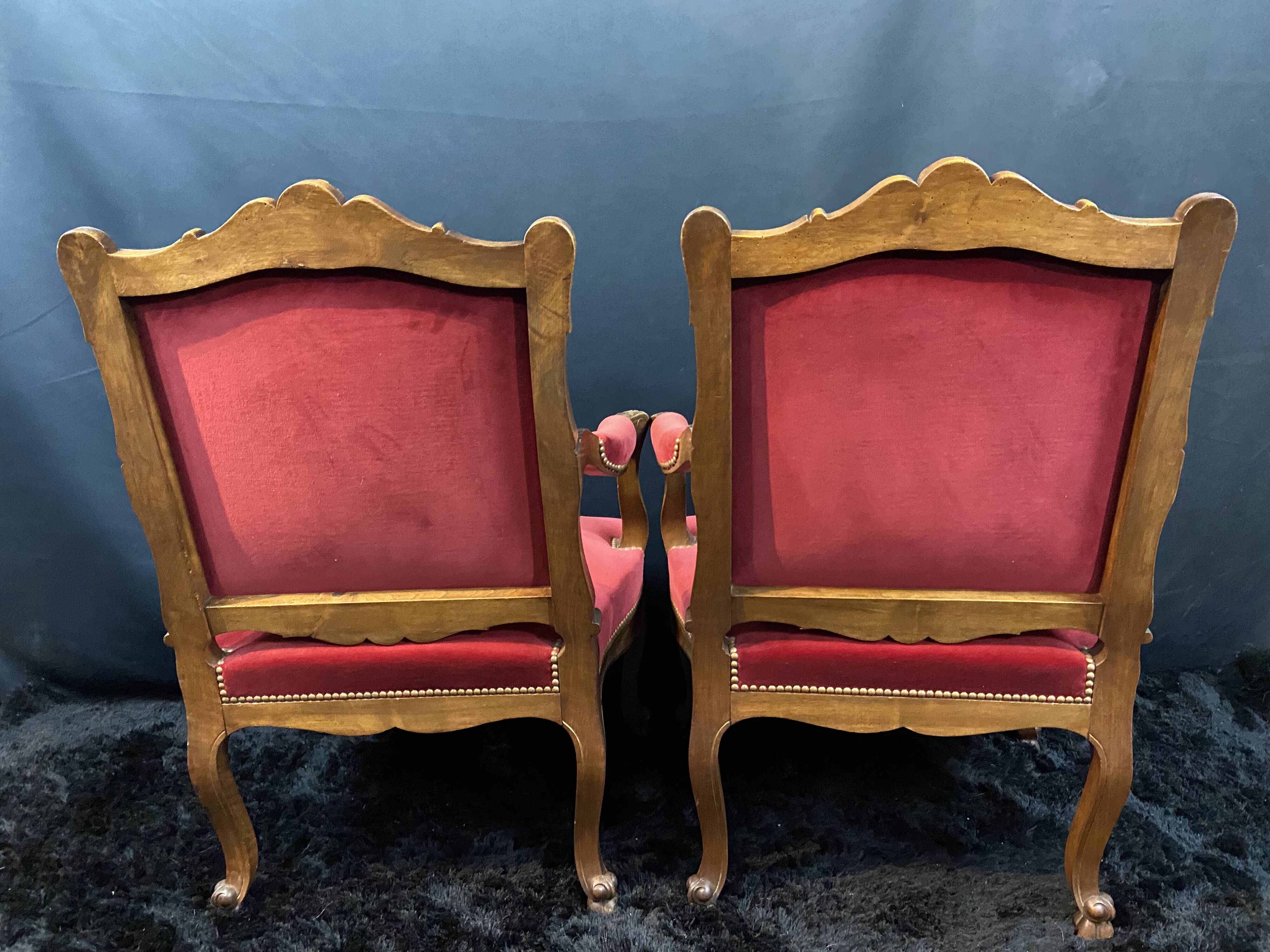 Pair of flat-back armchairs in Louis XV style in red velvet.