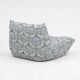 Togo lounge chair and pouf in patterned fabric by Michel Ducaroy for Ligne Roset, 1973, set of 2