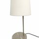 Large brushed metal table lamp with an ecru shade.