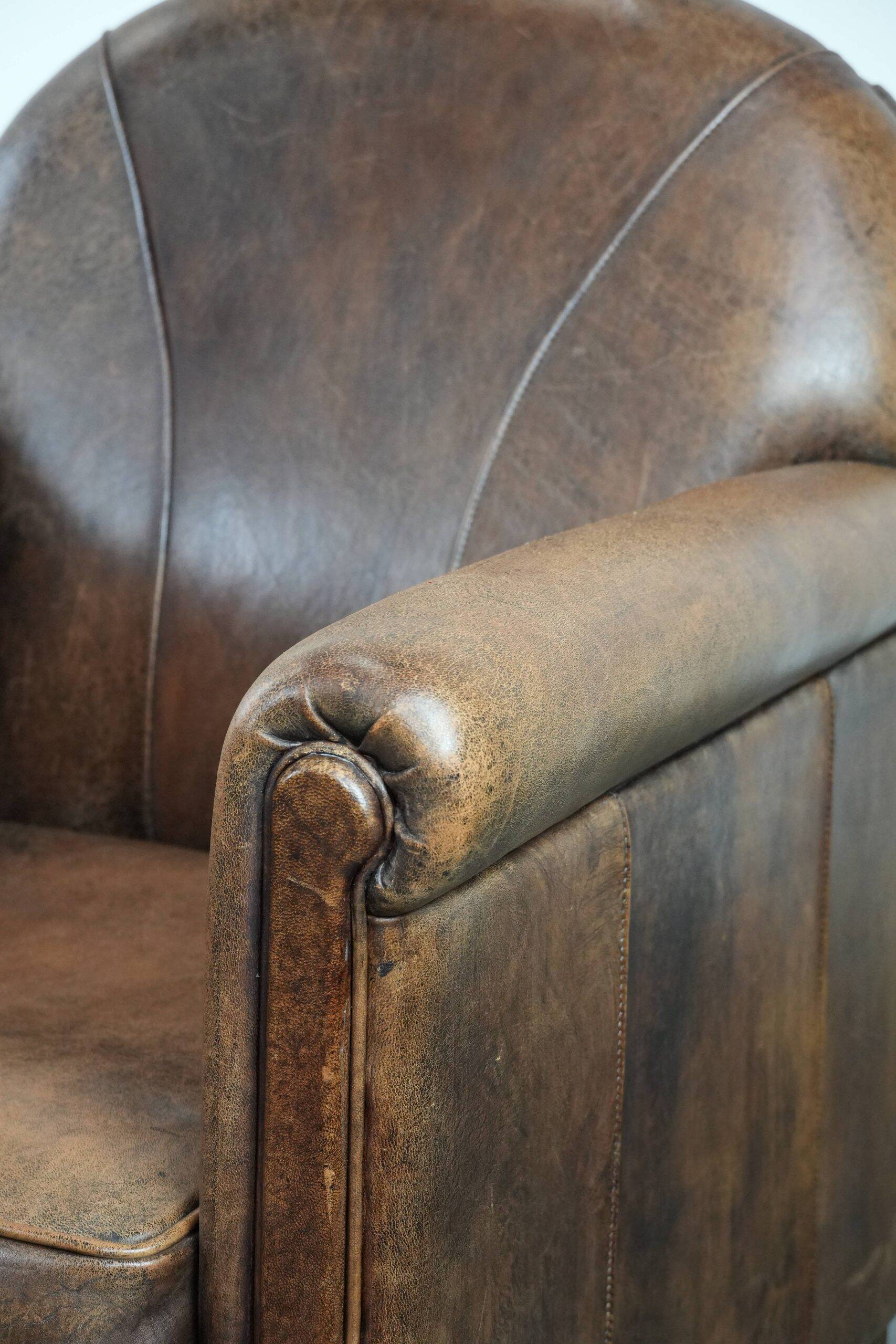 Set of 2 vintage sheepskin armchairs with a characterful appearance