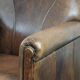 Set of 2 vintage sheepskin armchairs with a characterful appearance