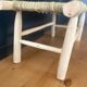 Natural wood bench and braided doum.