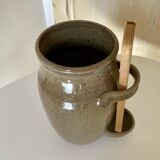 Old varnished stoneware pickle pot with tongs