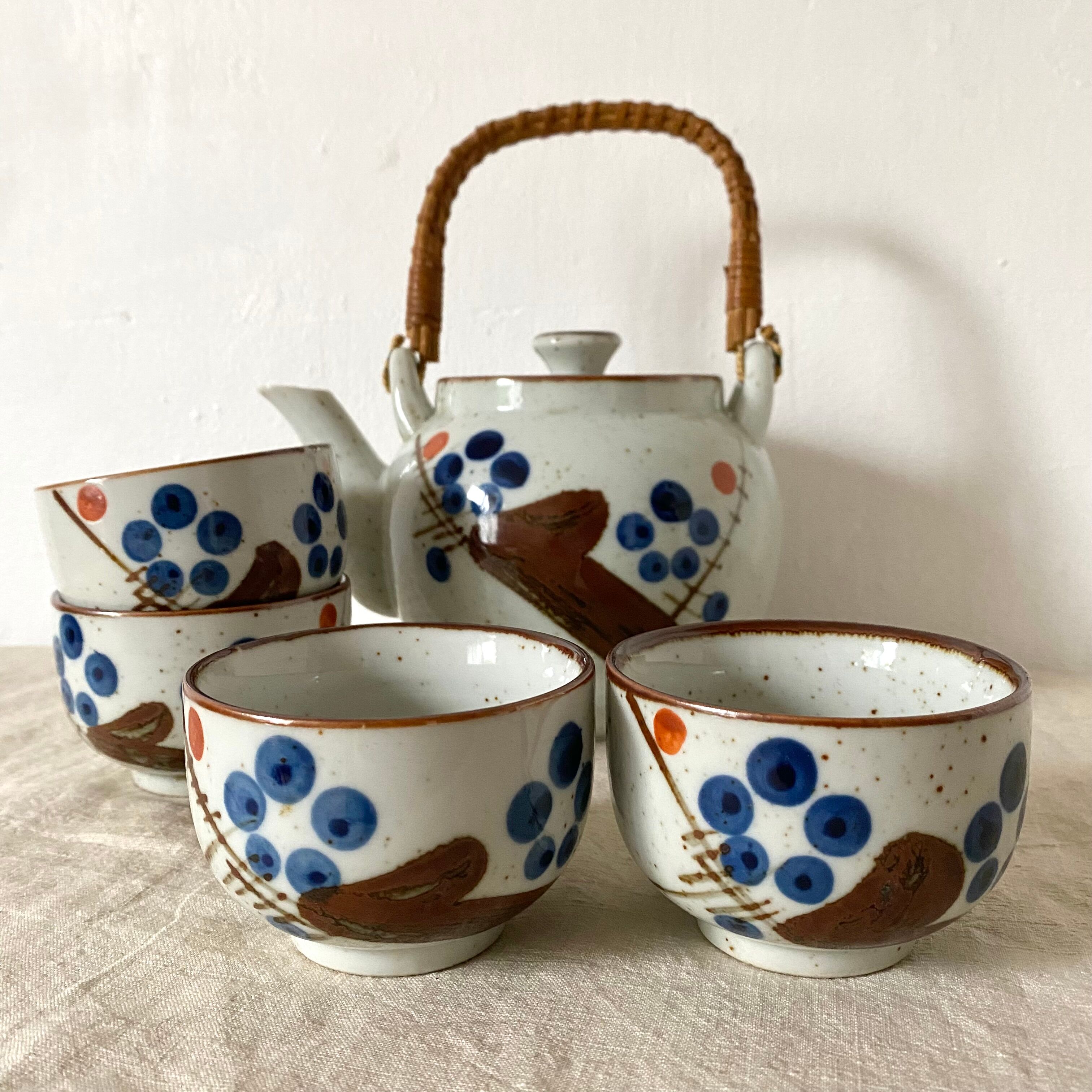 Stoneware teapot and vintage bowls