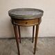 Louis XVI style bouillotte table in mahogany with a grey marble top.