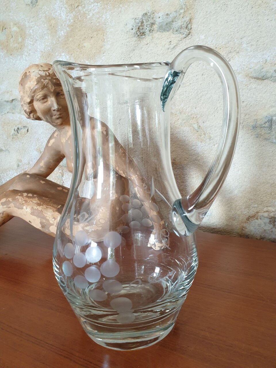 Pitcher decorating grape bunch