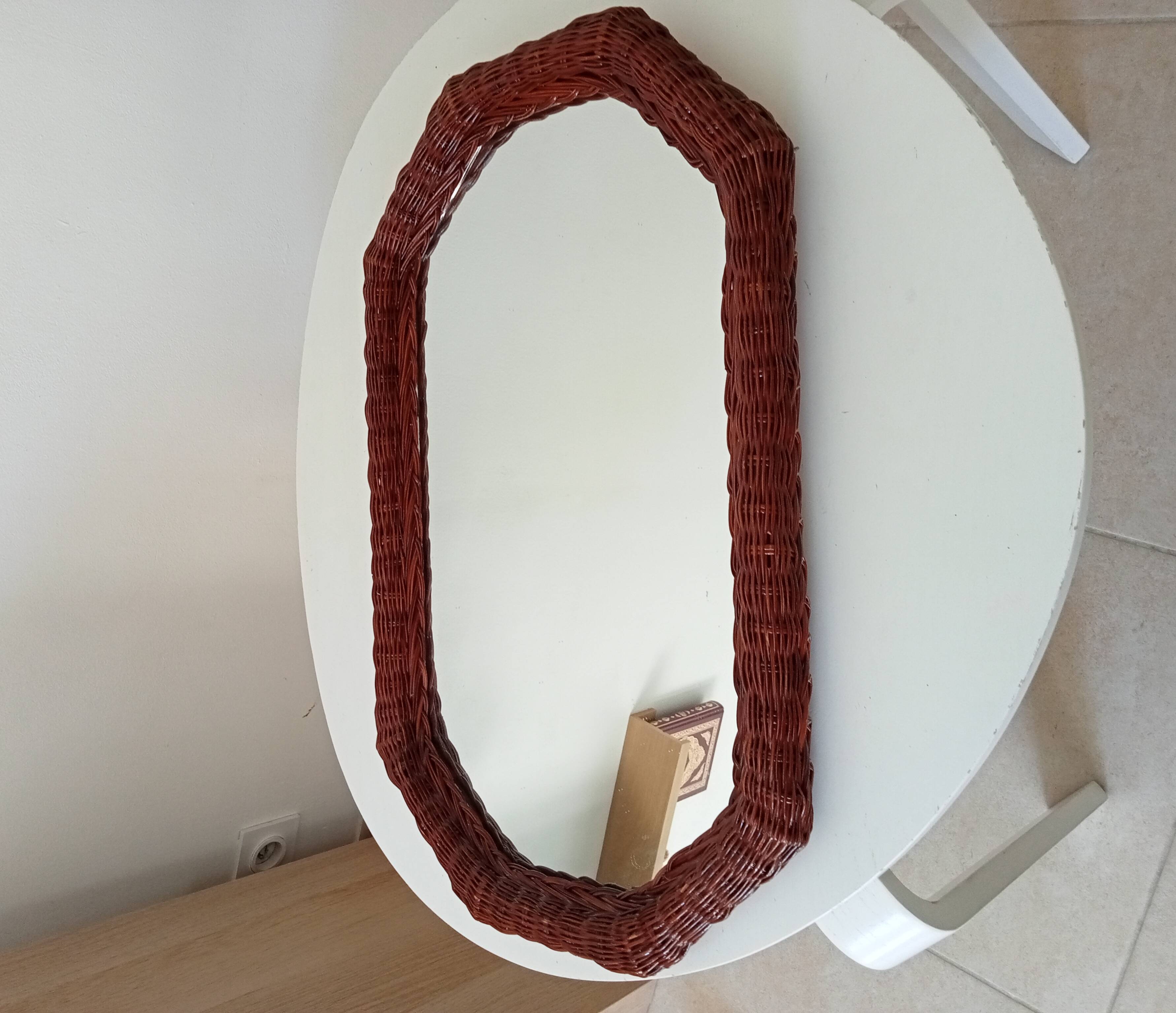 Vintage octagonal mirror in woven rattan.