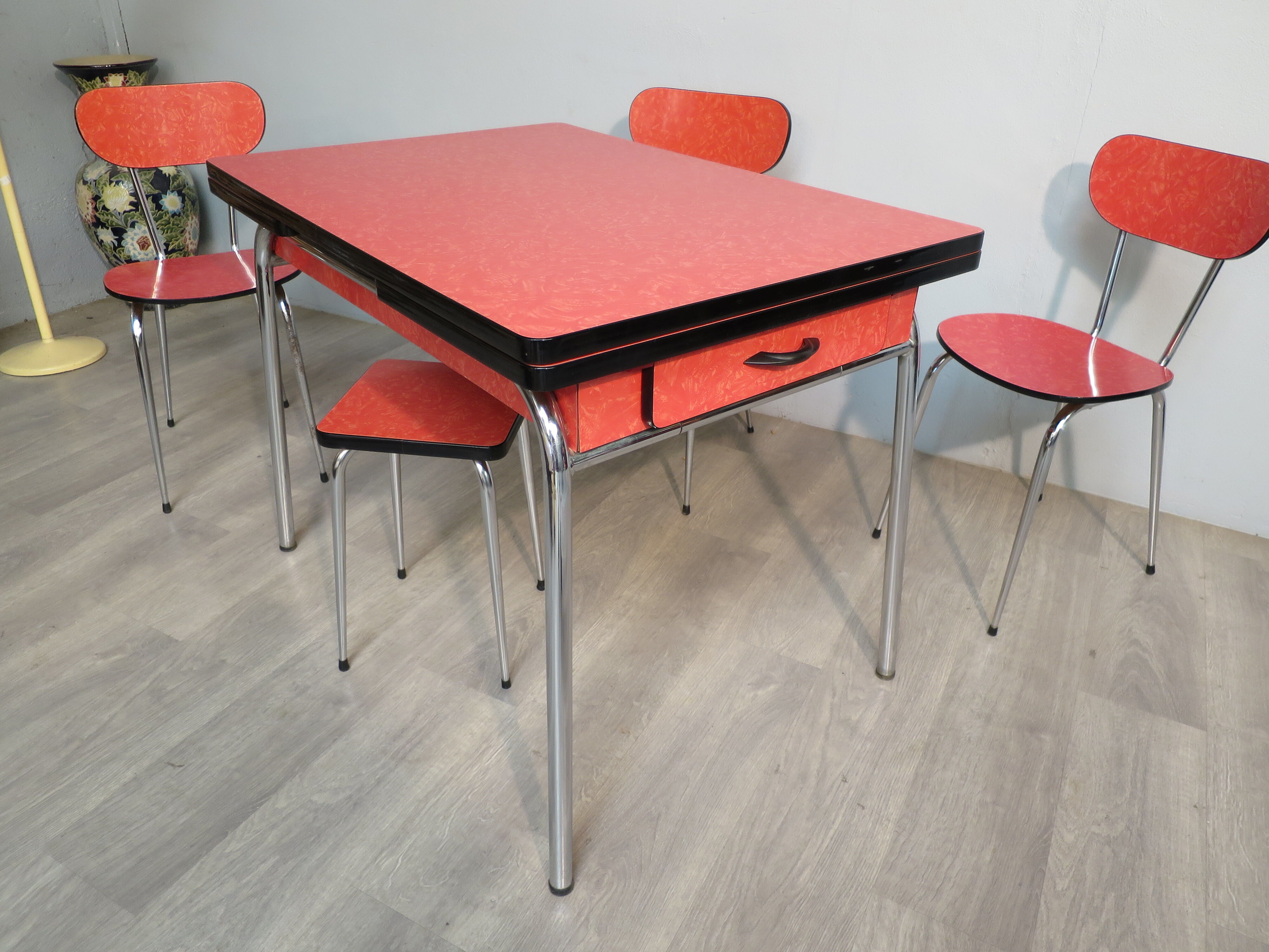 Table, 3 chairs and red formica stool