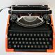 Silver Reed 200 orange metal typewriter made in Japan 70s