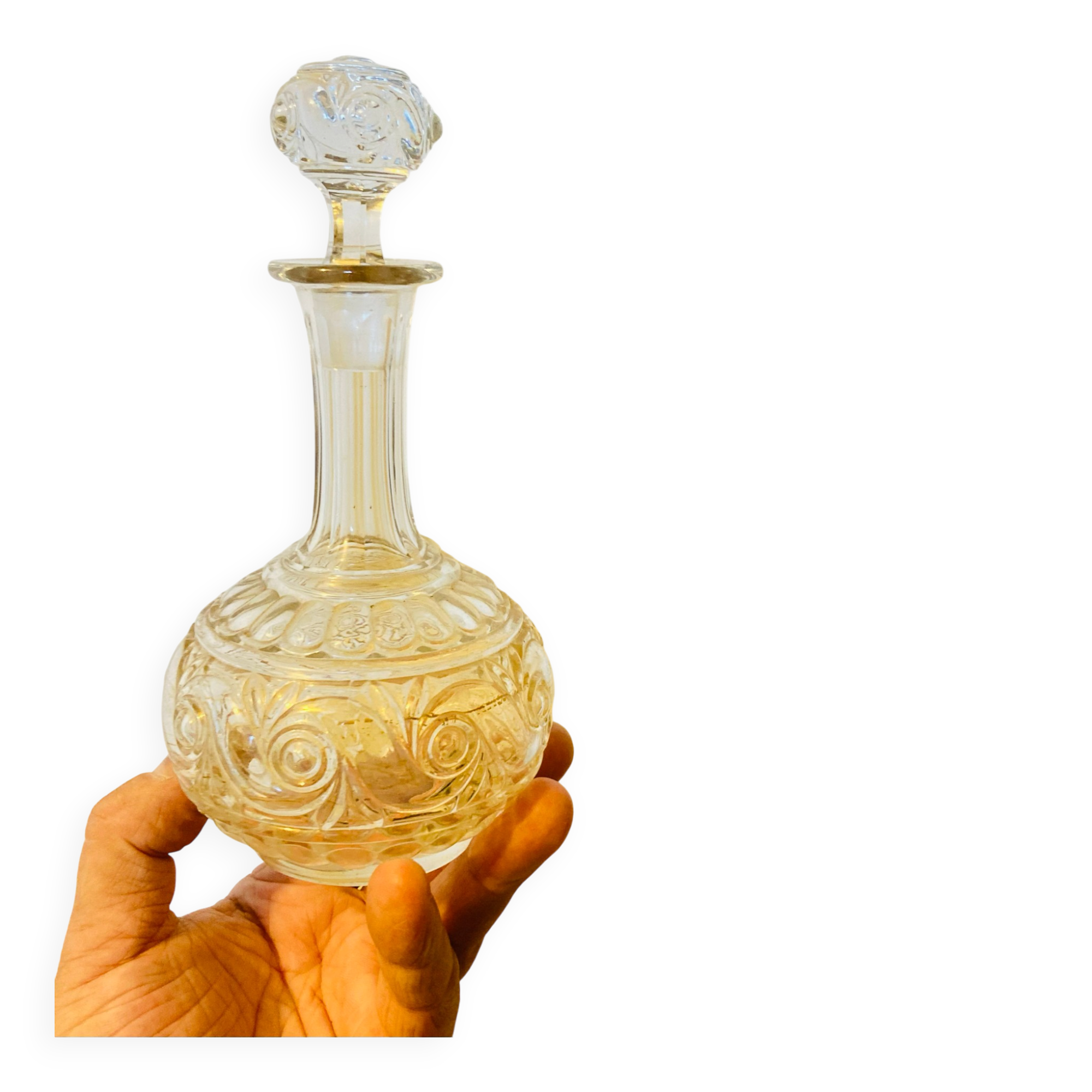 19th-century liqueur carafe in glass adorned with relief patterns.