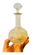 19th-century liqueur carafe in glass adorned with relief patterns.