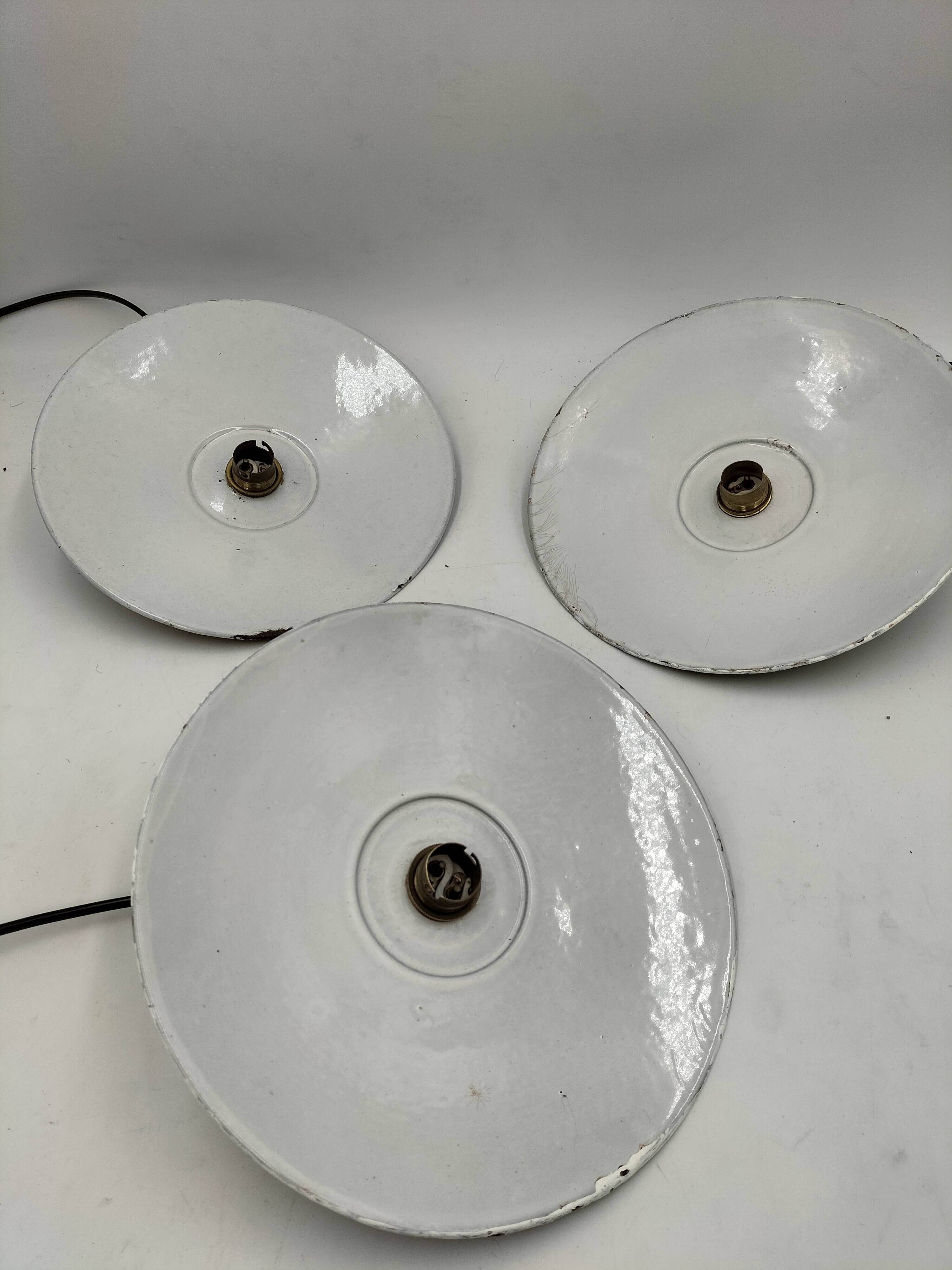 Three enamelled sheet metal suspensions