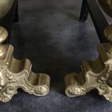 Paire de chenets en laiton et fonte, décor de marmousets, style louis xiv