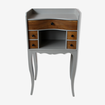 Gray curved bedside and wood