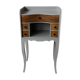 Gray curved bedside and wood