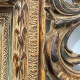 Napoleon III style mirror in carved wood, 20th century.