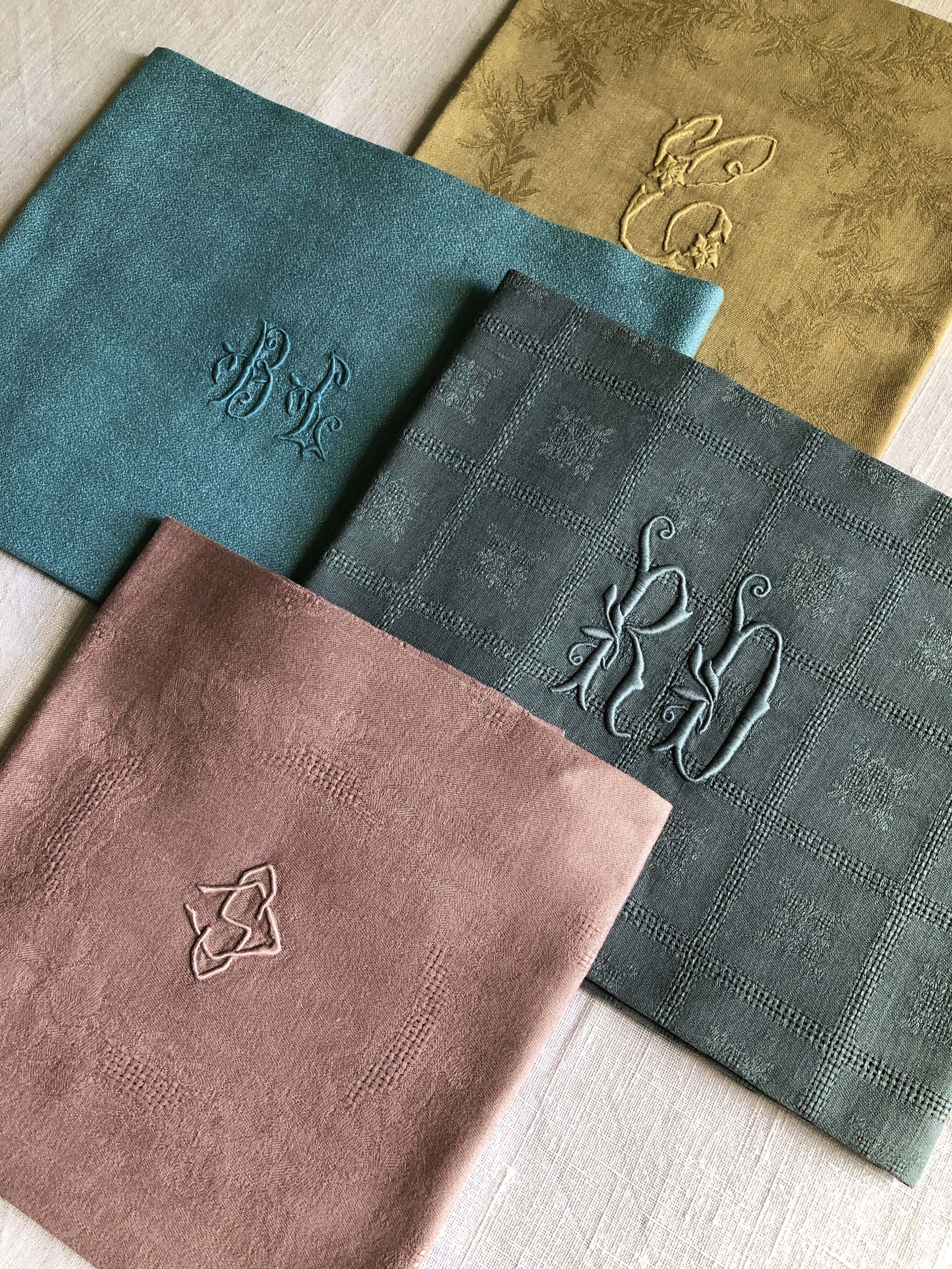 Suite of four tinted antique napkins