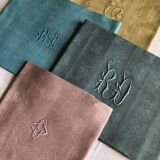 Suite of four tinted antique napkins