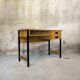 Vintage desk in modernist style made of wood.
