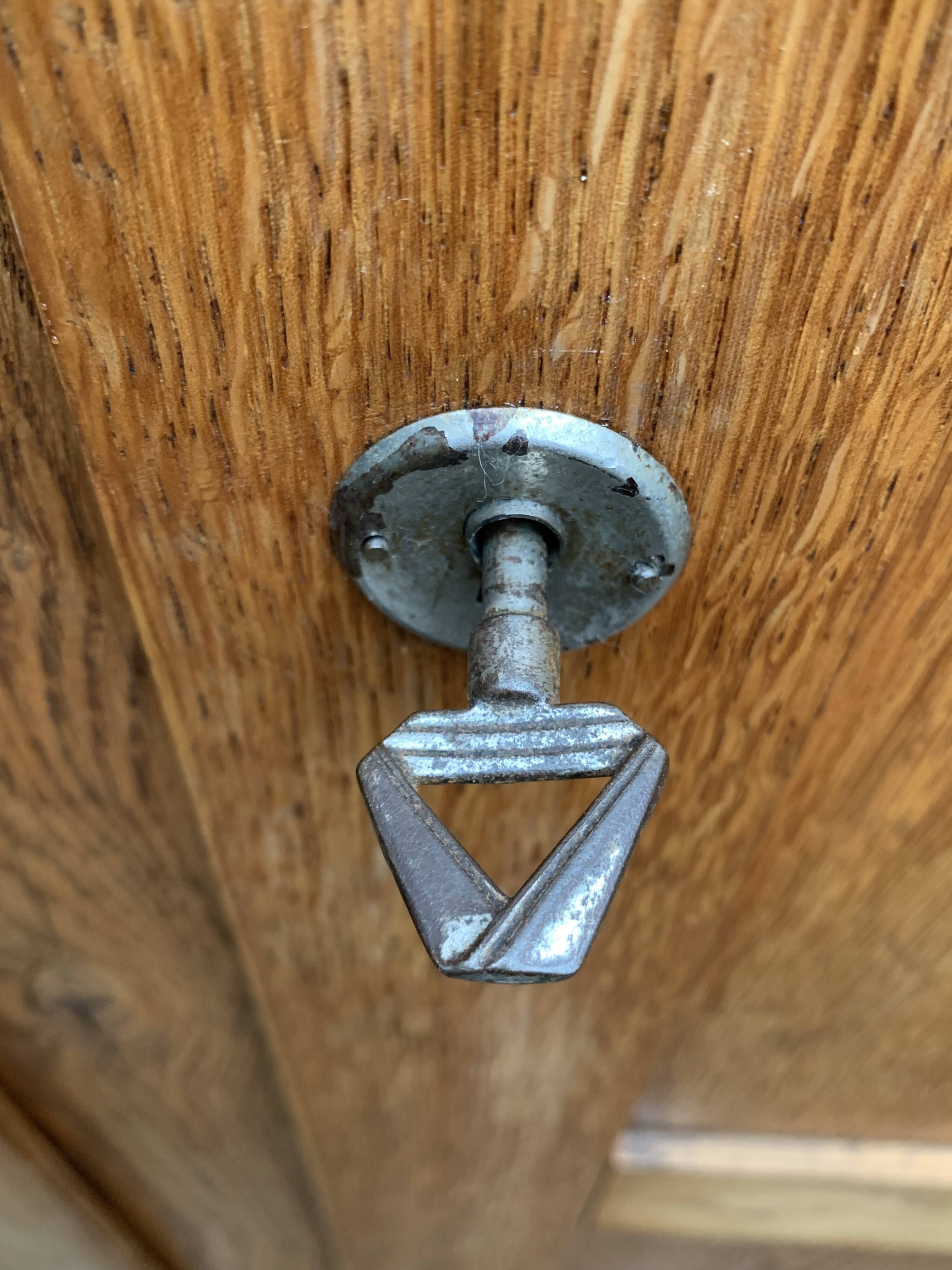 Solid oak compass foot cabinet René Gabriel 1945