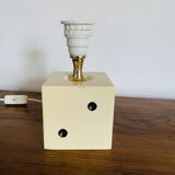 Lamp base representing a die