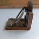 Medieval-style bookends, antique door handle.