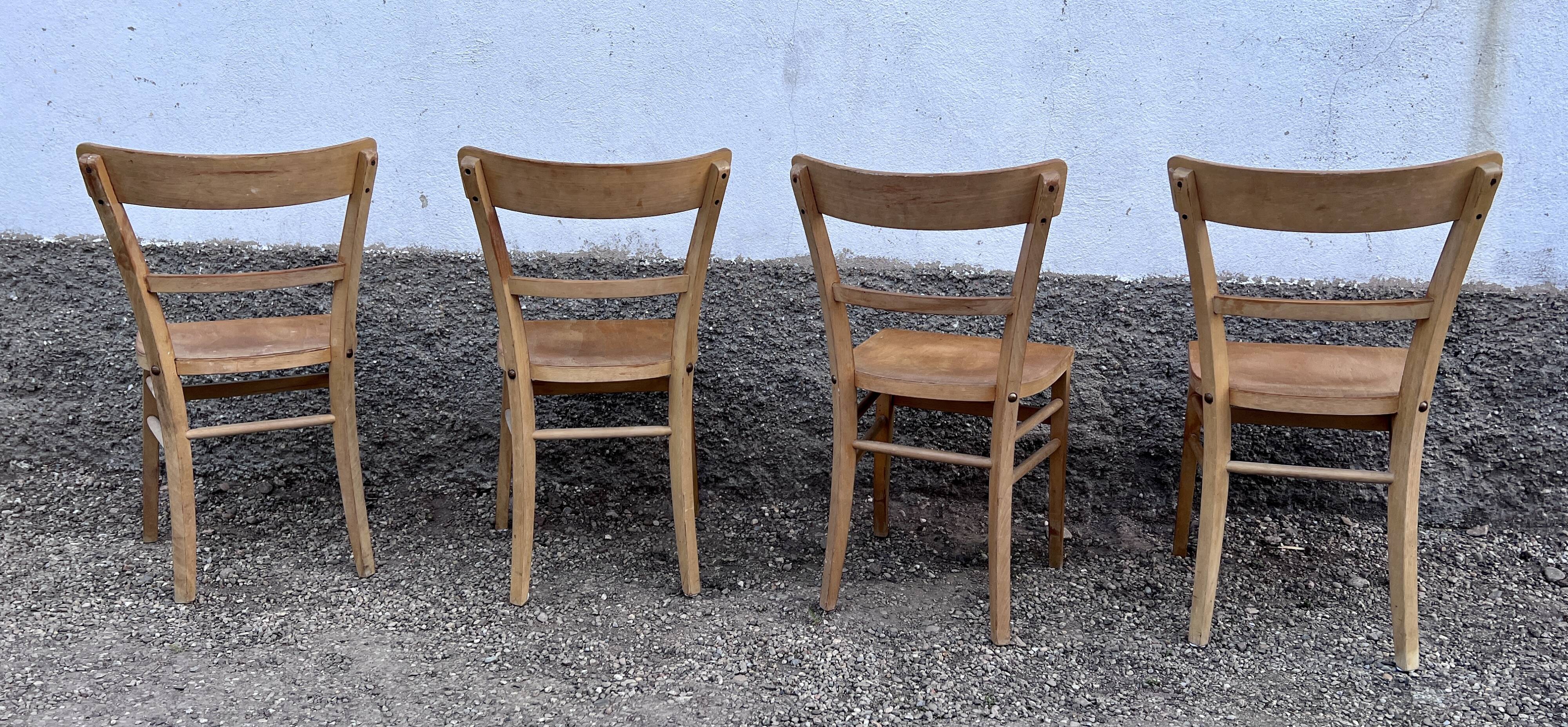 Series of 4 chairs in vintage light wood beech