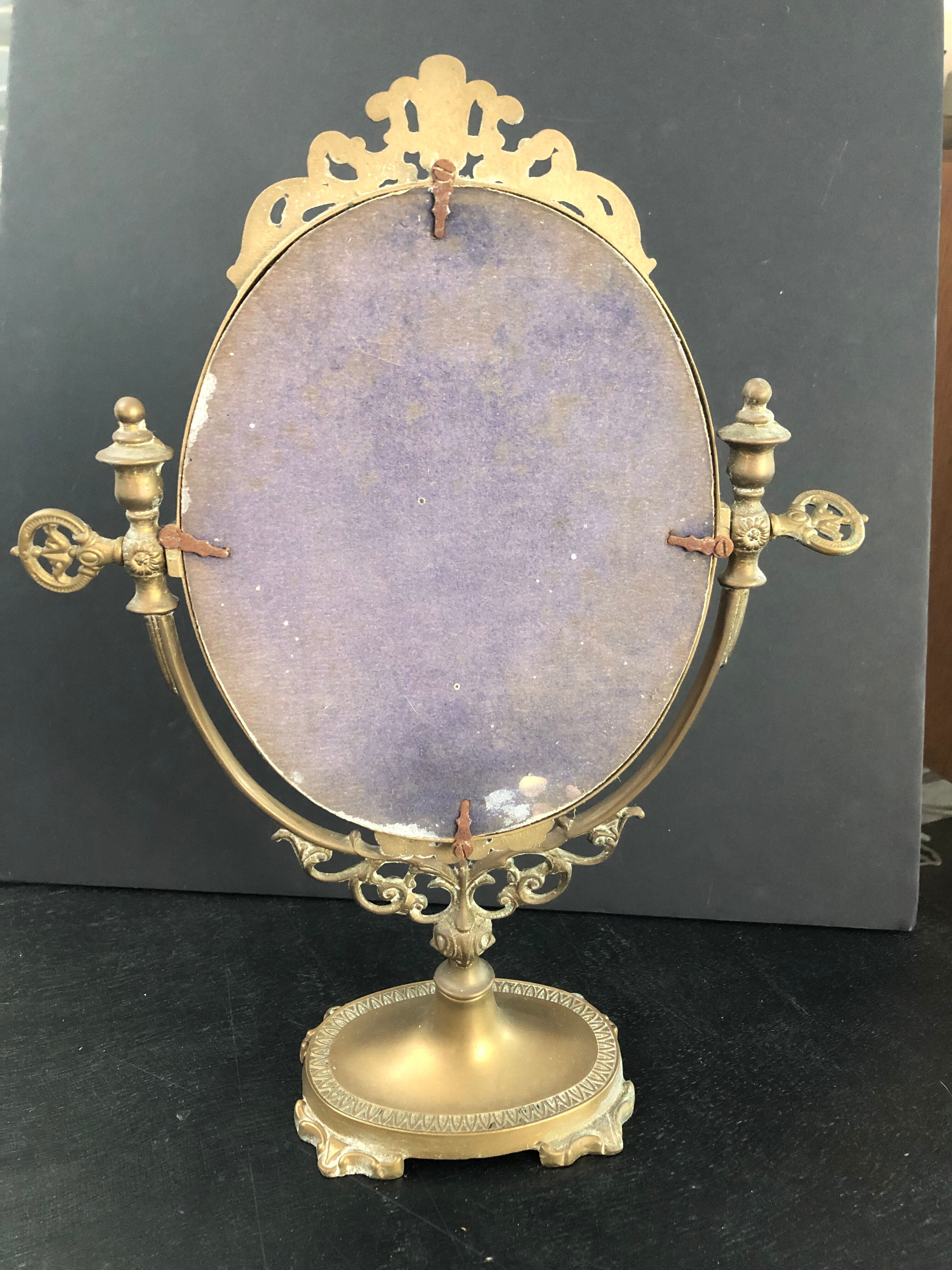 Swivel bronze mirror
