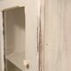 Glazed wall-mounted medicine cabinet in patinated wood