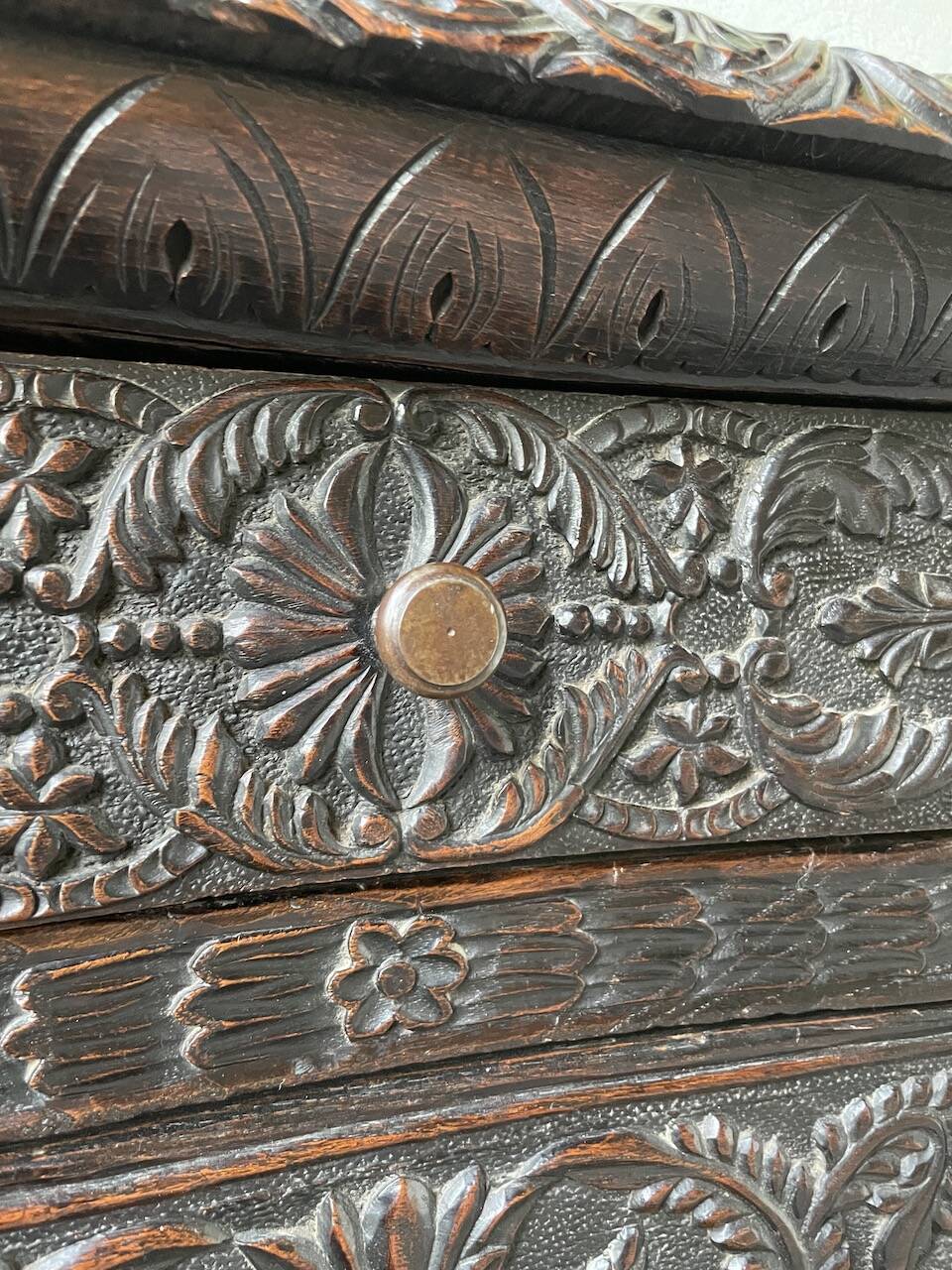 19th century chest of drawers in carved blackened pine