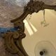 Antique mirror in Louis XV Rocaille style with carved frame.