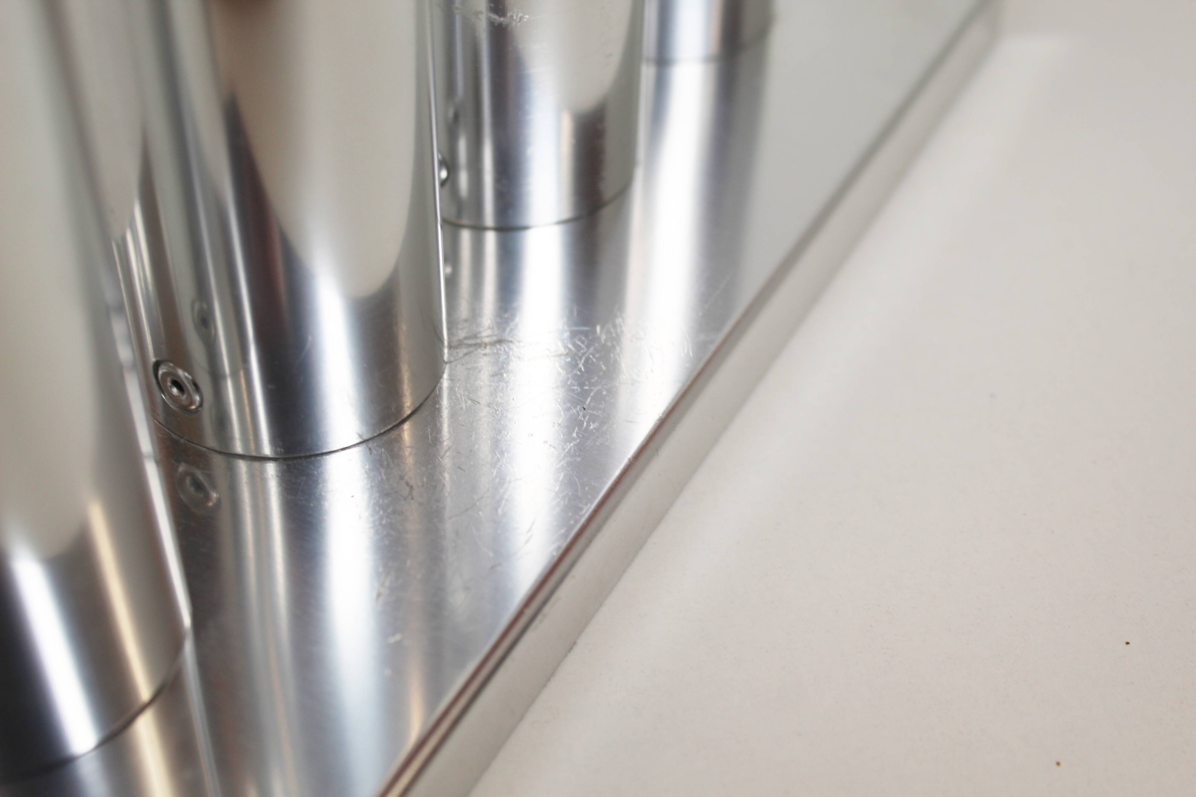 Pair of polished wall lamps by Gaetano Sciolari