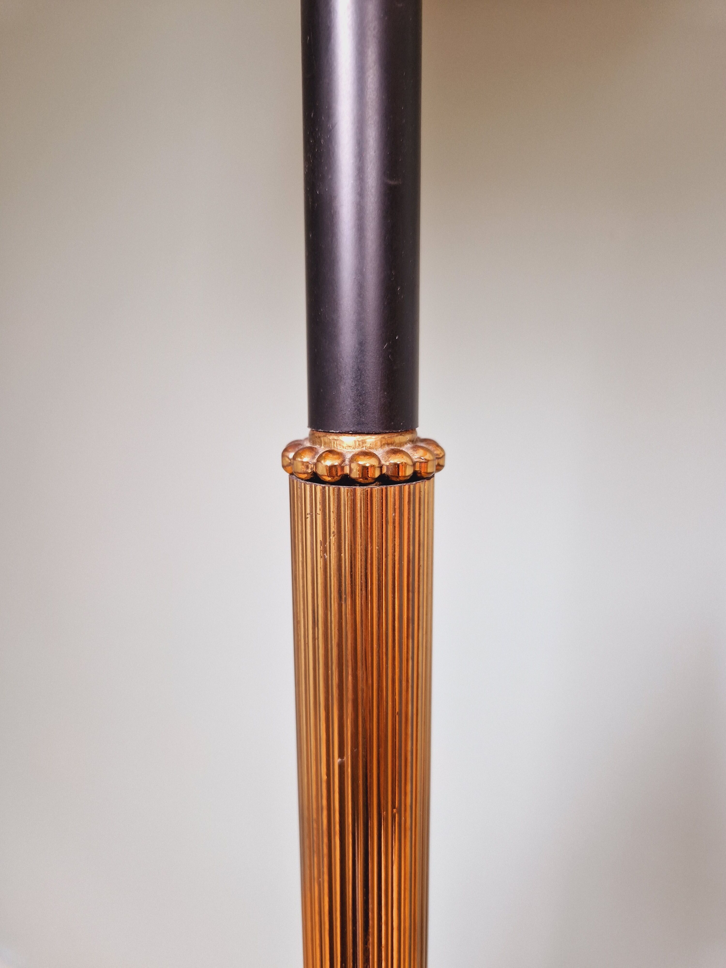 Vintage tripod floor lamp in black lacquered metal and brass, 50s