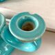 Pair of turquoise and gold double candlesticks