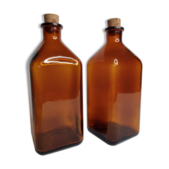 Two pharmacy bottles in amber molded glass 1 liter