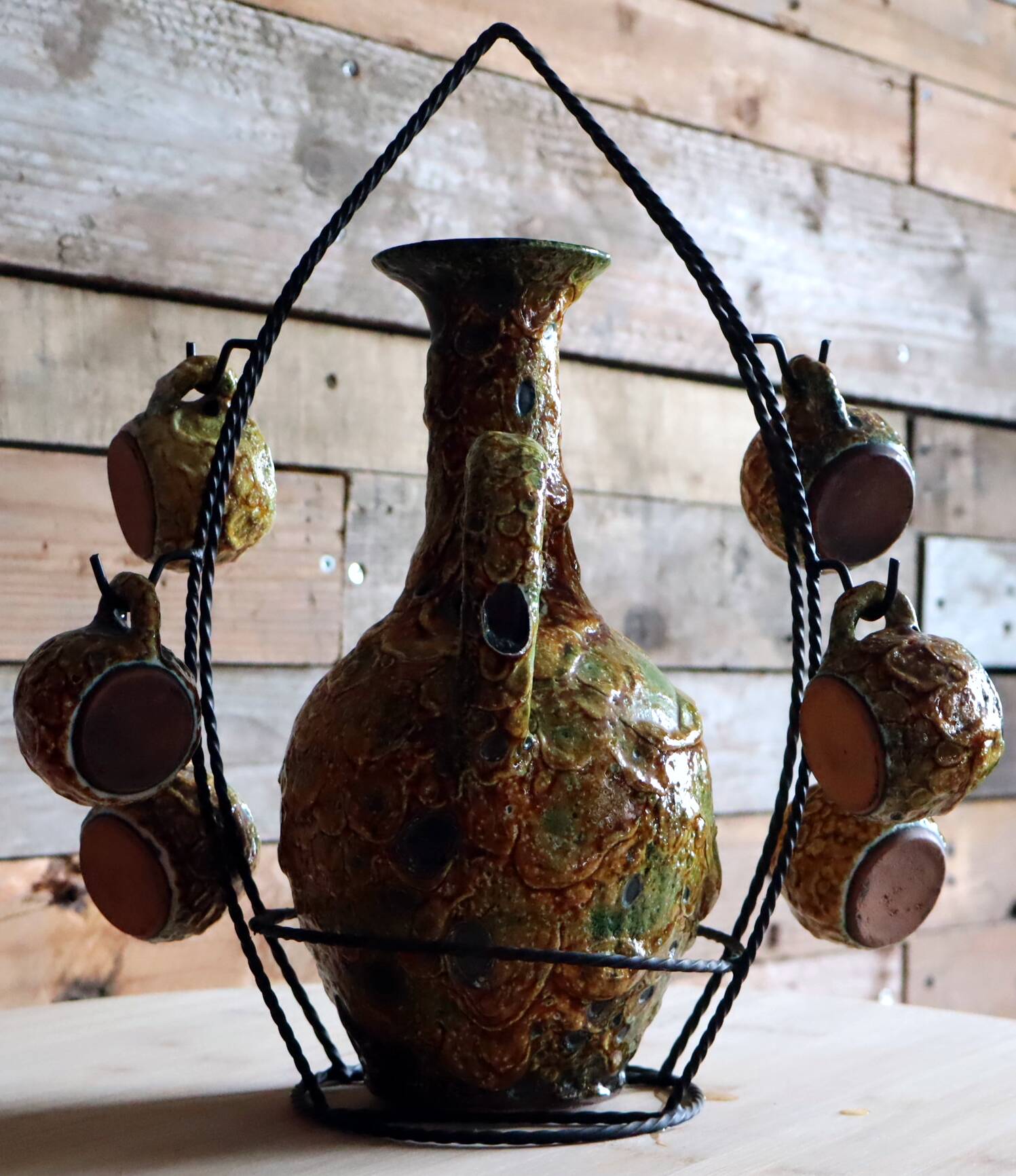 Vintage ceramic liqueur service "Fat Lava" and wrought iron