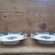 Pair of plates on presentation legs, terre de Fer Gien