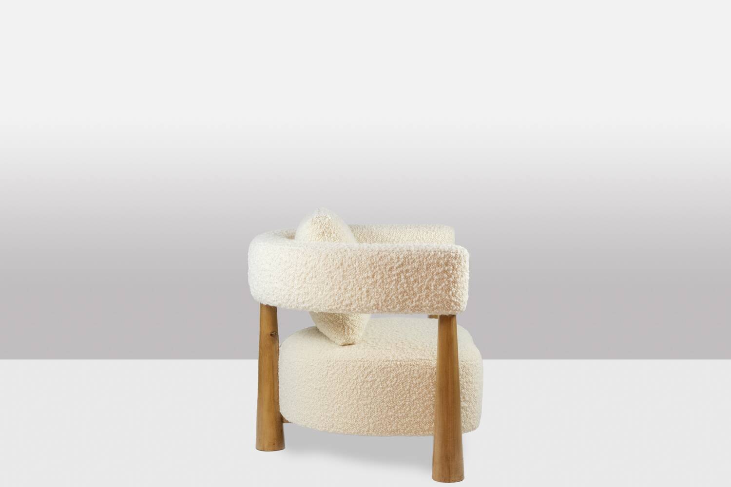 Pair of “bean” shaped armchairs, in blond beech. Contemporary work.